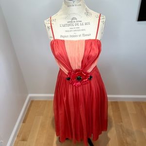 Vintage silk dress with leather hand made flower. Very good condition.